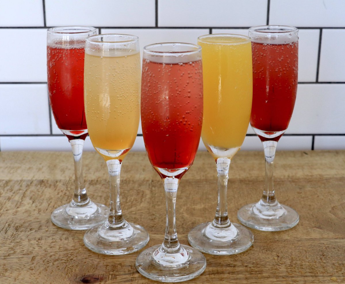 have you tried all the flavors of our mimosa rainbow? from left to right: strawberry, mango, pomegranate, classic (OJ), and blueberry 🥂