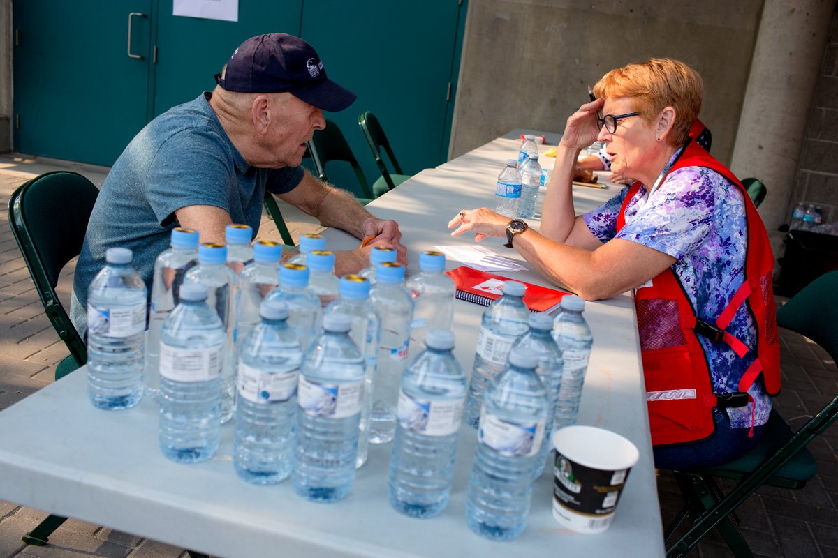 Red Cross volunteer is speaking to someone evacuated in the BC fires