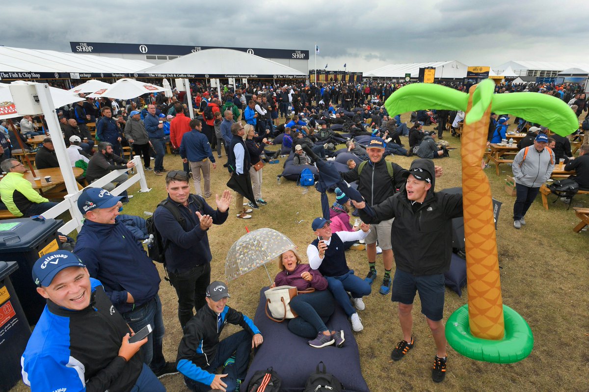 TheOpen's tweet photo. Damp clothes? Maybe. Damp spirits? Definitely not. #TheOpen https://t.co/L3fHSPZqZt