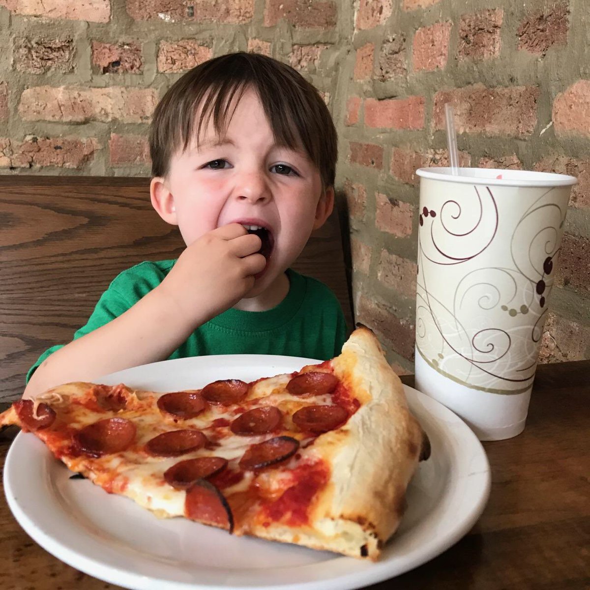 CraftPizzaChi's tweet photo. Levi, one of our favorite regulars chowin down on his @EzzoSausageCo pepperoni pizza! 🍕🍕🍕 https://t.co/nQMGWVo0bG