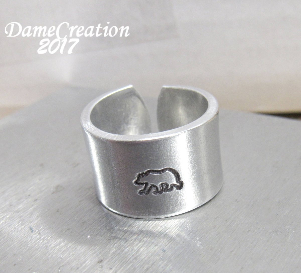 DameCreation's tweet photo. SALE Silver Stamped Ring - Bear Ring - Bear Jewelry - Nature Jewelry -… https://t.co/yMsXuP3WC1 #CraftBuzz #BearRing https://t.co/YwwIDNtFHi