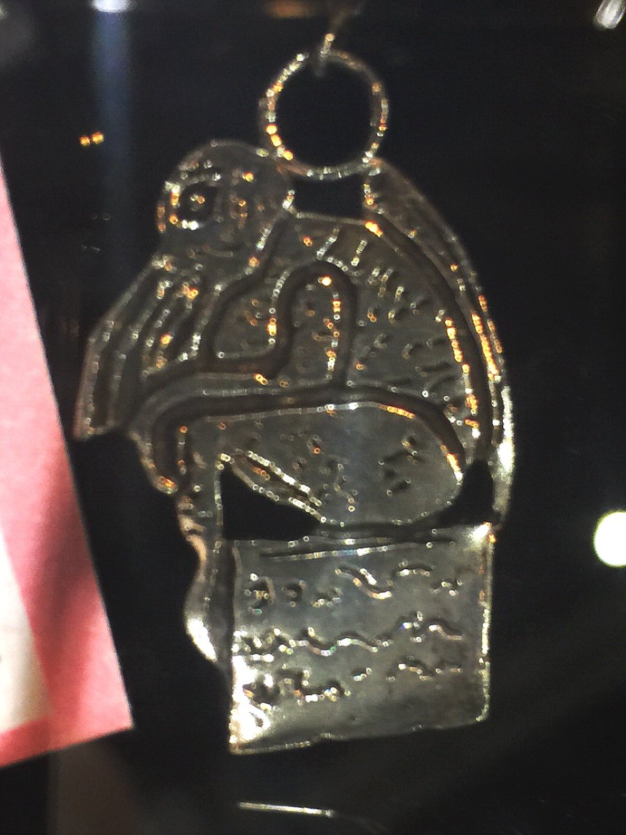 SighCoGraphics's tweet photo. Hidden Lovecraftian treasure at Sigh Co. booth 523. Limited edition HAND WROUGHT SILVER CTHULHU based on the drawing by Lovecraft. #SDCC https://t.co/pgXuGzkJym