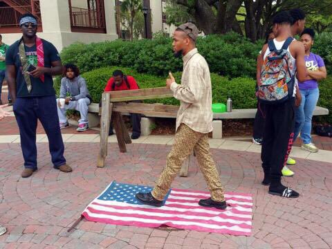 wizkhalliah's tweet photo. #EricSheppard and co. walked on the American Flag on campus and had the whole nation shook lol. One big mess #VState #FlagRally #FreeSpeech https://t.co/Zu7kl83k1O