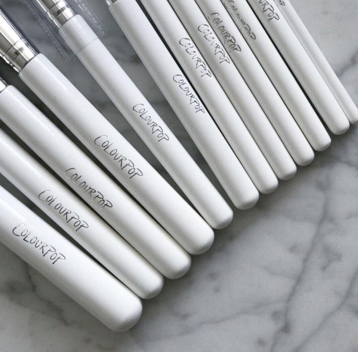 ColourPopCo's tweet photo. White handles. Silver logo. 12 brushes 👀 https://t.co/nEI3vqDur3