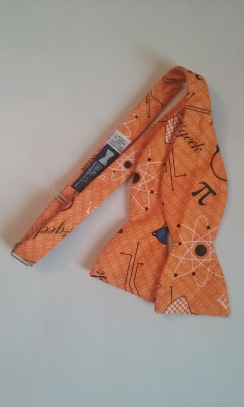 MathTieMonday's tweet photo. This vibrant orange #bowtie from @BeauTiesGuy is perfect for celebrating #ApproximatePiDay! #math  #mathtie #beauties #bowtiesarecool #pi https://t.co/ctKg0VLMS4