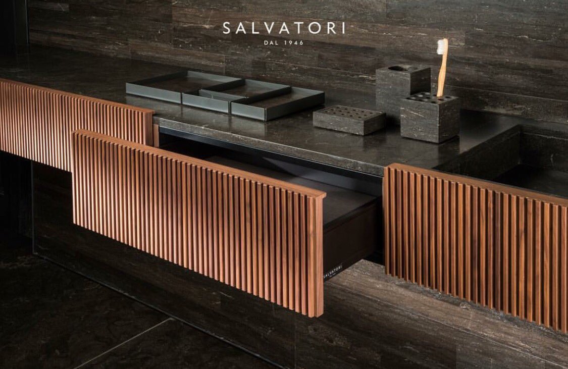 CodeVancouver's tweet image. Closeup of the Adda bathroom collection with basin in natural stone and drawers in ribbed walnut #SalvatoriStone #CodeShowroom