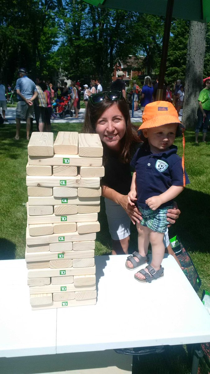 MichelleW_TD's tweet photo. Playing Giant Jenga with youngest TD volunteer at Victoria Park grand re-opening #ProudNana #TDCommonGround #YGK https://t.co/mg1id8vvX7
