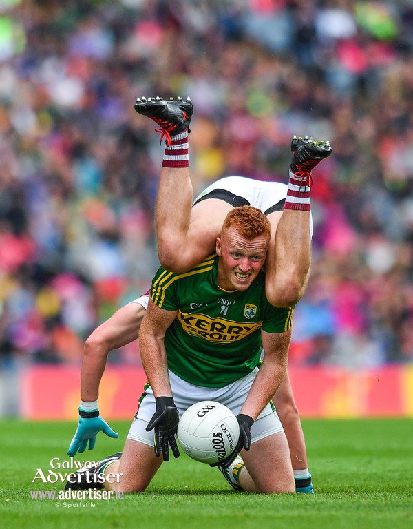declanvarley's tweet photo. Good shot from @sportsfile - Johnny Buckley of Kerry is tackled by Gary O'Donnell of Galway. Pic  by Ramsey Cardy https://t.co/dtgts6zhAn