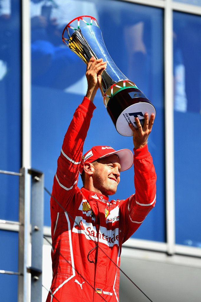 sebvettelnews's tweet photo. Sebastian Vettel with his trophy on the podium 😊🏆

#HungarianGP 🇭🇺 #F1 #Seb5 https://t.co/2xcx87XuvH