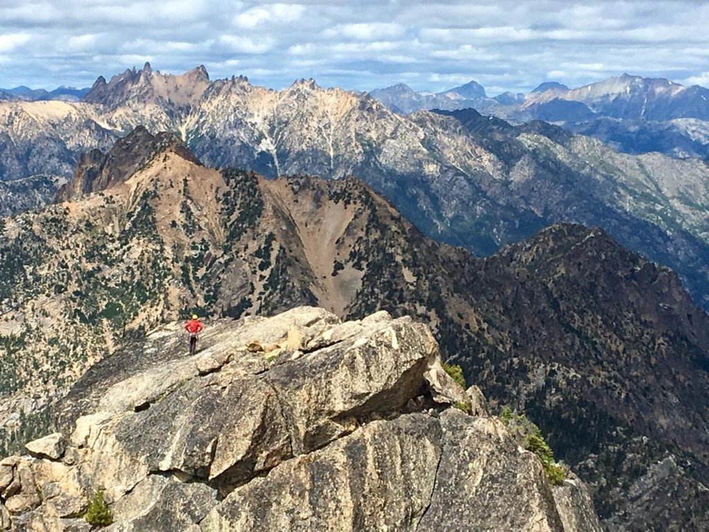 reynafoto's tweet photo. Climber in red on top of North Early Winter Spire with the North Cascades in the background. #rockclimbing #northcascades https://t.co/Hg6mwAhGHH
