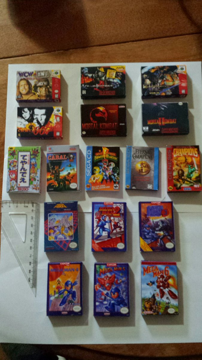 warmachine169's tweet photo. @CartFamNL Decided to put my creative skills to good use. Making myself  collection of mini boxes. #NES #SEGA # SNES #N64 #SEGACD https://t.co/PEhNdqIgbw
