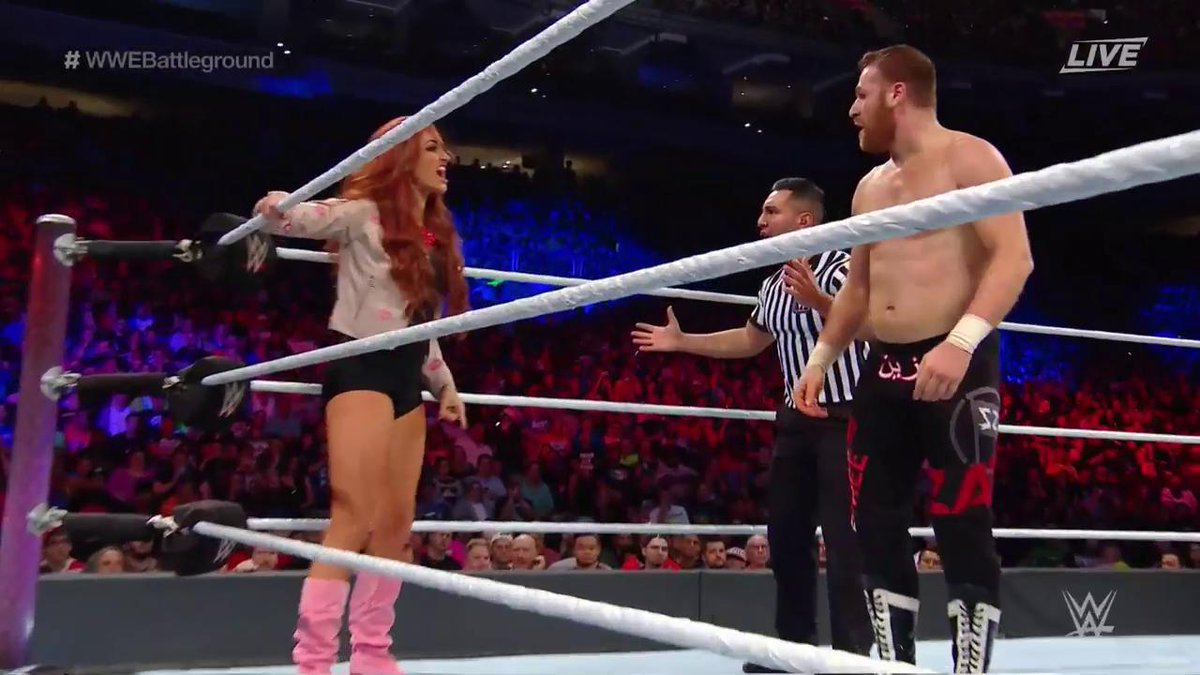 WWEUniverse's tweet image. #ExploderSuplex in the corner gets STIFLED by @MariaLKanellis! @SamiZayn is none too pleased... #WWEBattleground