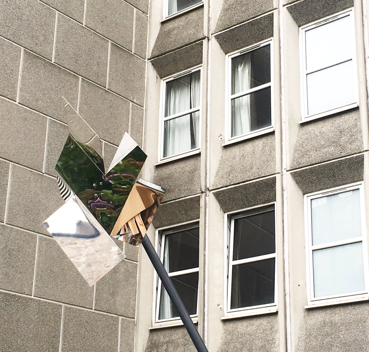 OpenCloseArt's tweet photo. Scintillator by Toby Paterson reflecting glimpses of the buddleia wilderness in the gap site off Chalmers Close. #chalmersclose #openclose https://t.co/uuAzmLiCQx