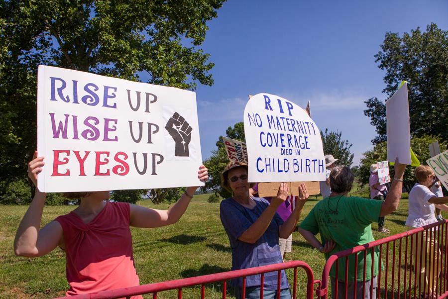 IndivisibleGCo's tweet photo. Denbied access! Tillis must be pissed. Had police move us across the street behind bars! 7/11 #tuesdaywithouttillis #indivisiblehighpoint https://t.co/sE6CAhFShQ