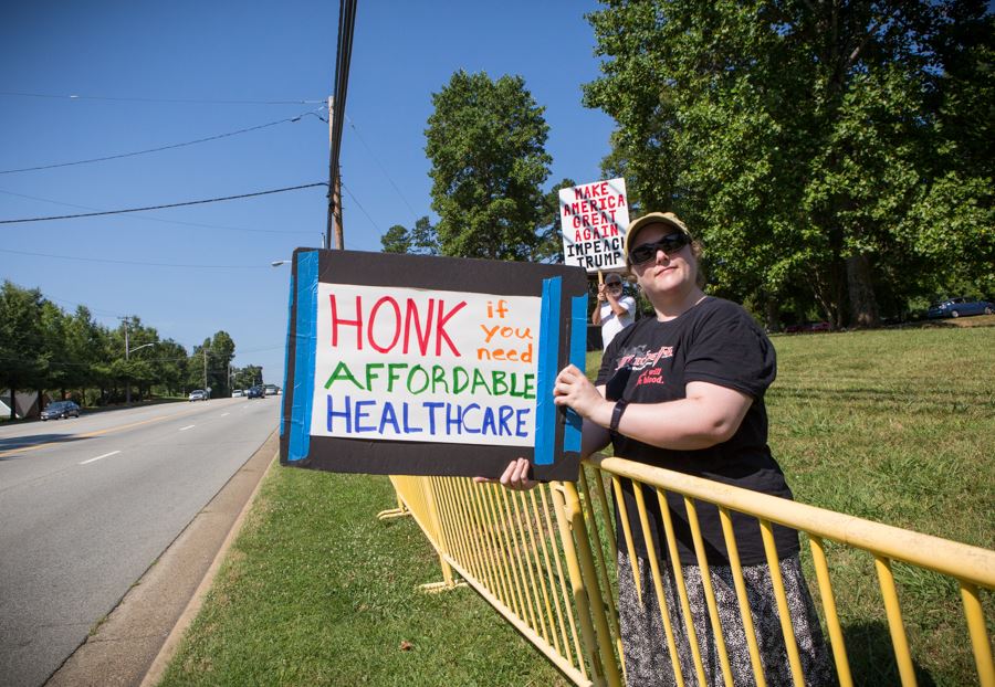IndivisibleGCo's tweet photo. Denbied access! Tillis must be pissed. Had police move us across the street behind bars! 7/11 #tuesdaywithouttillis #indivisiblehighpoint https://t.co/sE6CAhFShQ