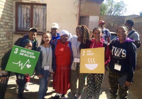 ARProject's tweet photo. @Journey4Change Ambassadors & #CapPrep teachers Ms. Moye & Mr. Johnson advocate for @SDGoals in Diepsloot, #SouthAfrica. #SDGs @DrStevePerry https://t.co/9bjrH1vDQs