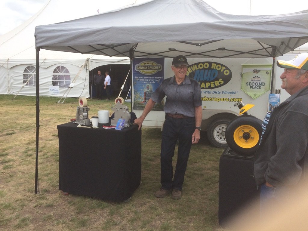 Dad at Ag in Motion with his Canola Crushers and our #RotatingMudScrapers