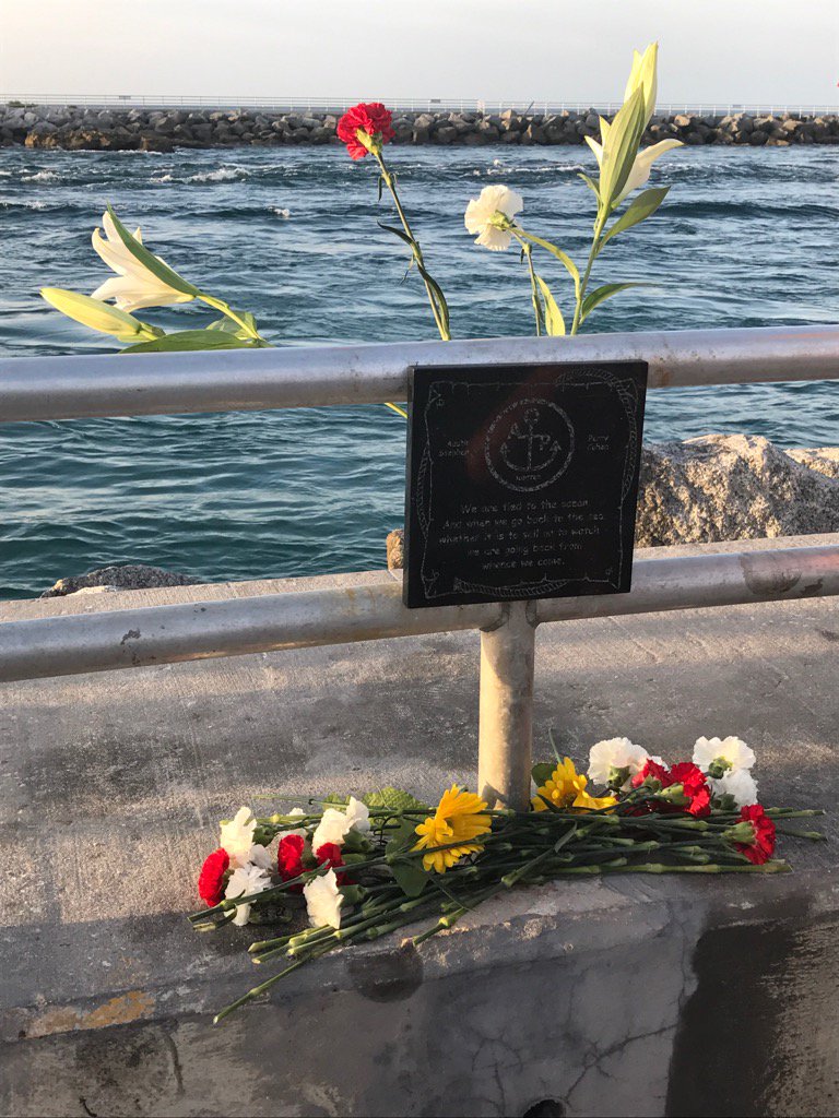 M_Quesada's tweet photo. Flowers set by #AustinAndPerry plaque at Jupiter inlet @WPTV https://t.co/2cQA2HIC5b