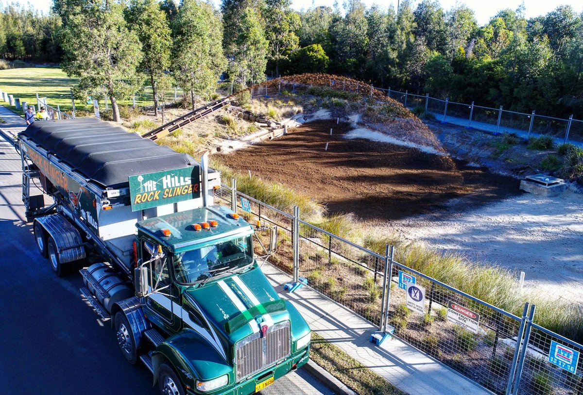 HillsBarkBlower's tweet photo. Bioretention basin being filled by one of our #rockslinger trucks. #jobsitesmadeeasy #lnamember #expressblower #slinger #sydneyconstruction https://t.co/zw0uMALrLn