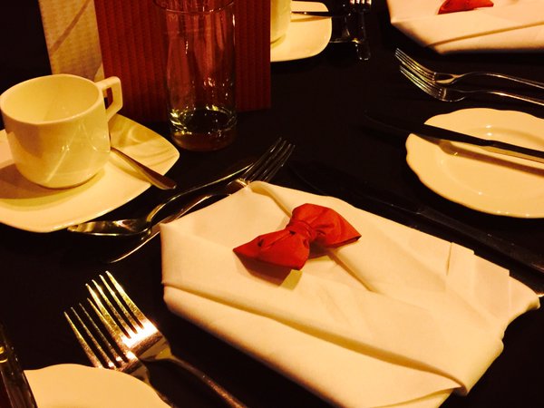 LydiaComms's tweet photo. Just found this photo of our table settings for @EducateAwards 2015! Definitely worth hand folding 500 napkins into bow ties ๐@HannahFoundry https://t.co/0zbBmwwtYn