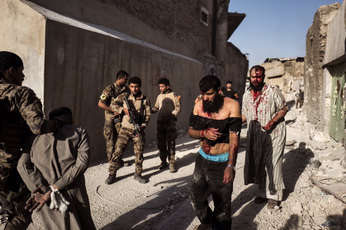 Suspected ISIS fighters being led through streets of Mosul a few days before liberation was announced #battleformosul #photojournalism #war