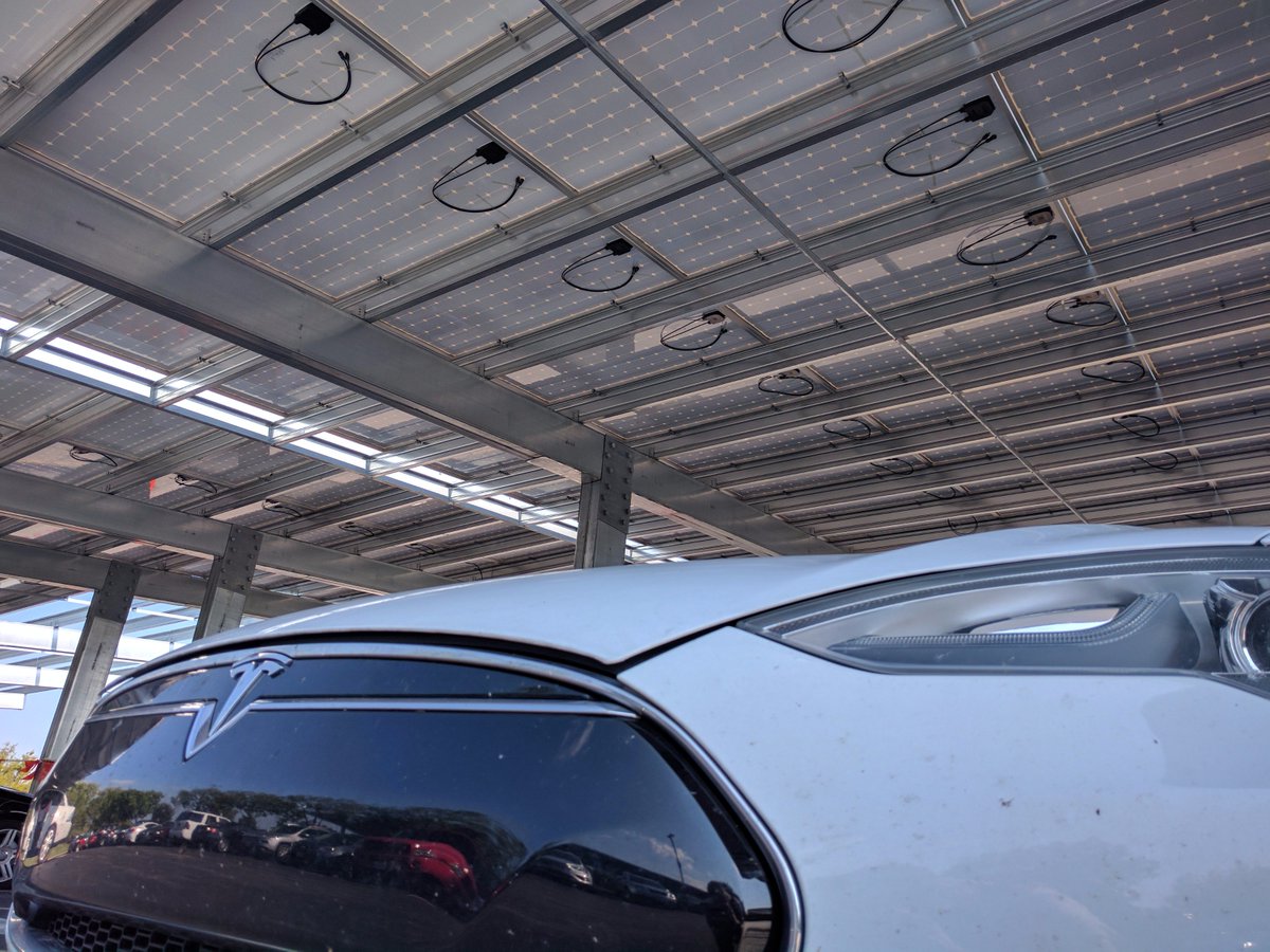Solar canopies are up at #MasterCard. Soon this #Tesla will be driving on sunshine ☀️ @TeslaMotors