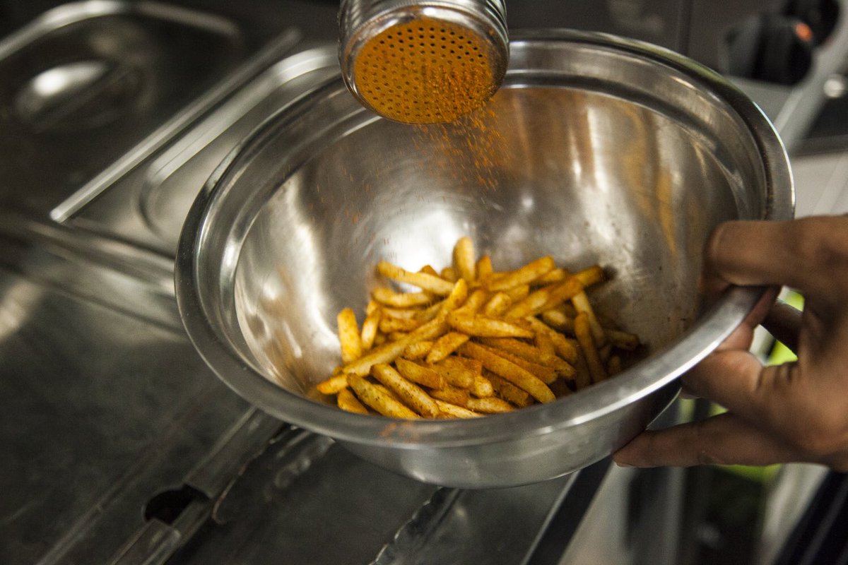 motudelivery's tweet photo. Our fries getting a healthy dose of special Masala seasoning #MotuDelivery https://t.co/Zwq8FvAMef
