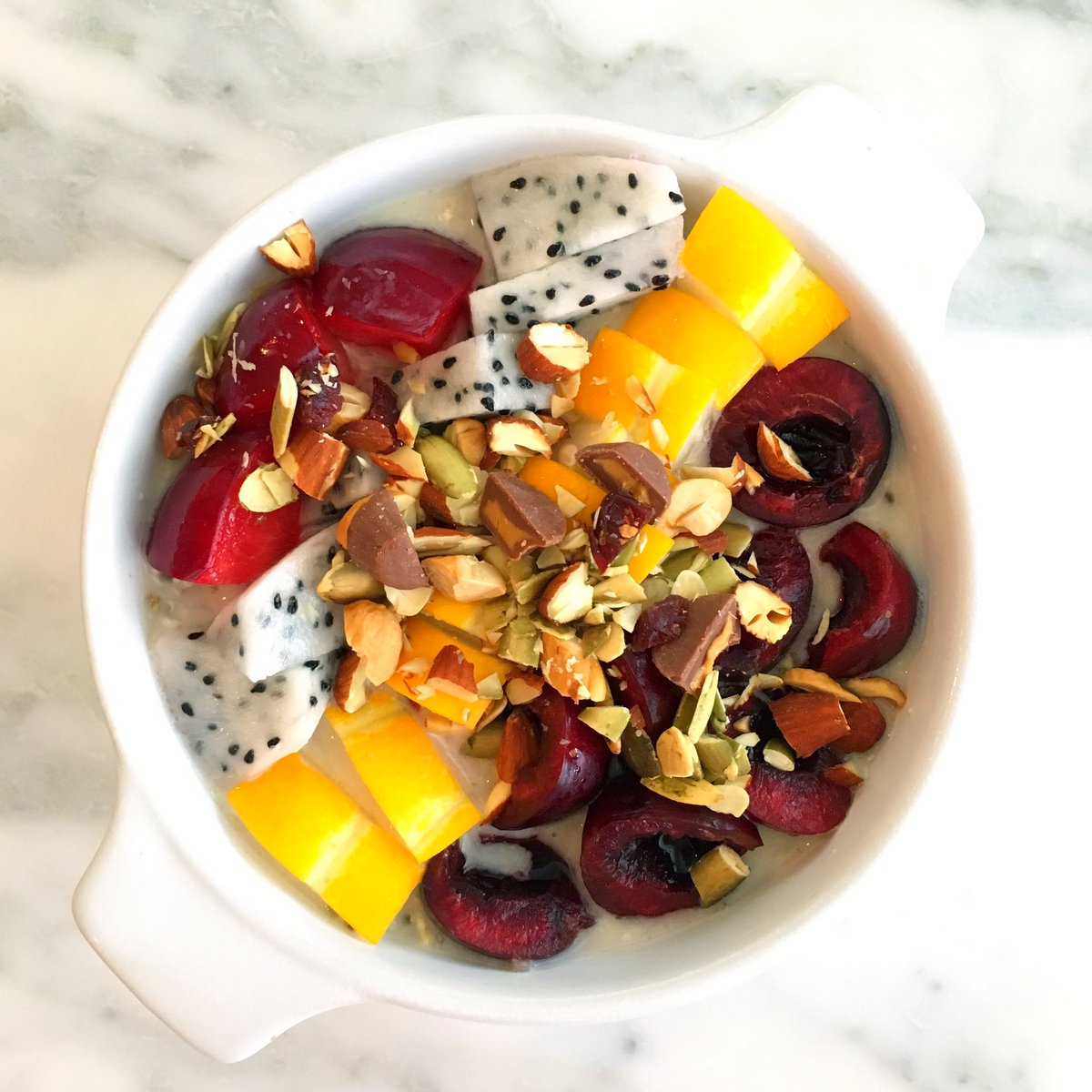 ShanCooks's tweet image. overnight oats and chia seeds in flax milk, cherries, yellow melon, dragon fruit, plums, nuts and peanut butter nibs 🌱#vegan #rawvegan