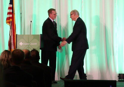 CoBank's tweet photo. CoBank board member Scott Whittington welcomes @SenPatRoberts to the #FarmCredit Week in Washington stage! #FarmBill18 @farmcredit https://t.co/cxRxEokmkM