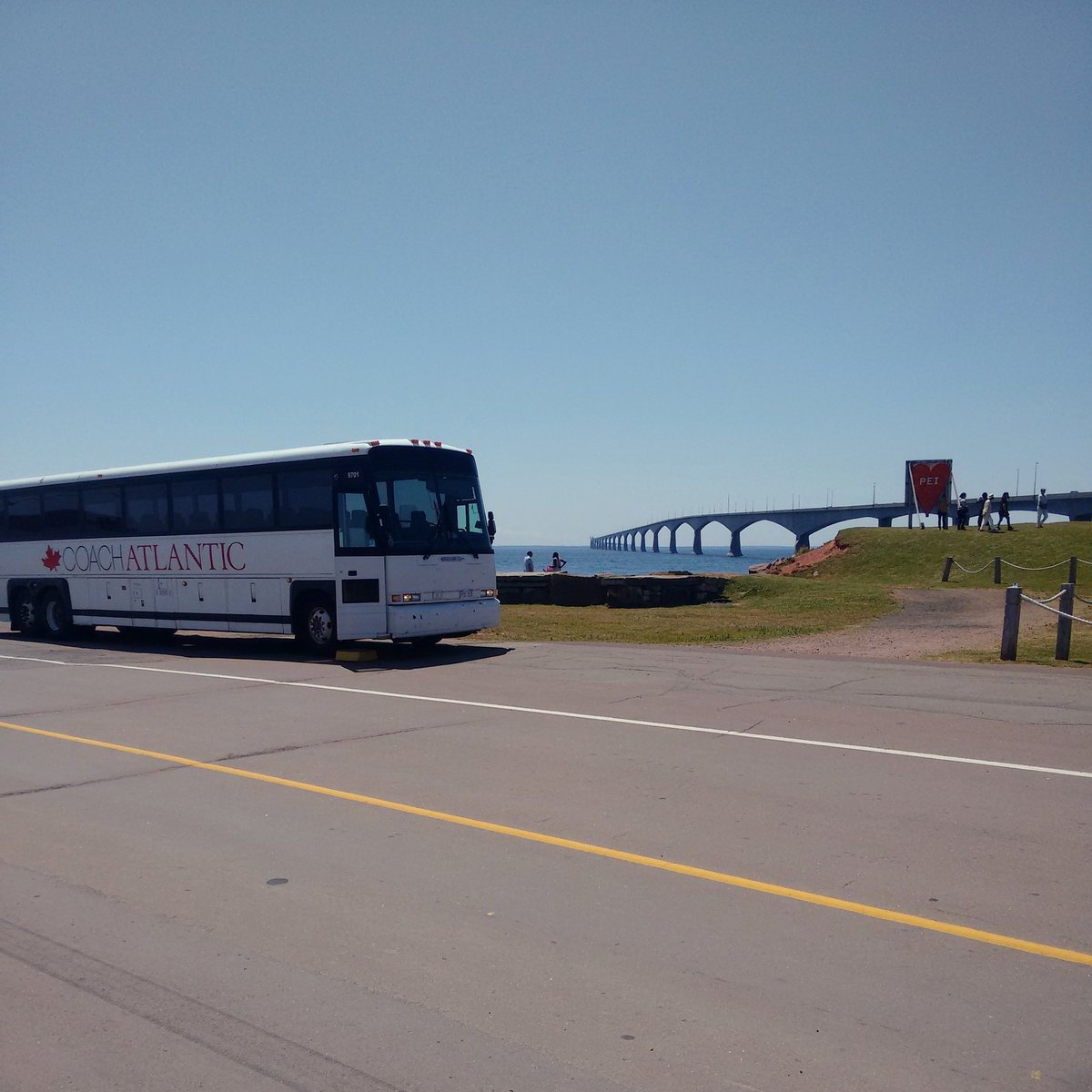 coachatlantic's tweet photo. Coach on the road! Taking a quick stop for a different view of the bridge! #charter #views #pei https://t.co/z1KtdEB6i2