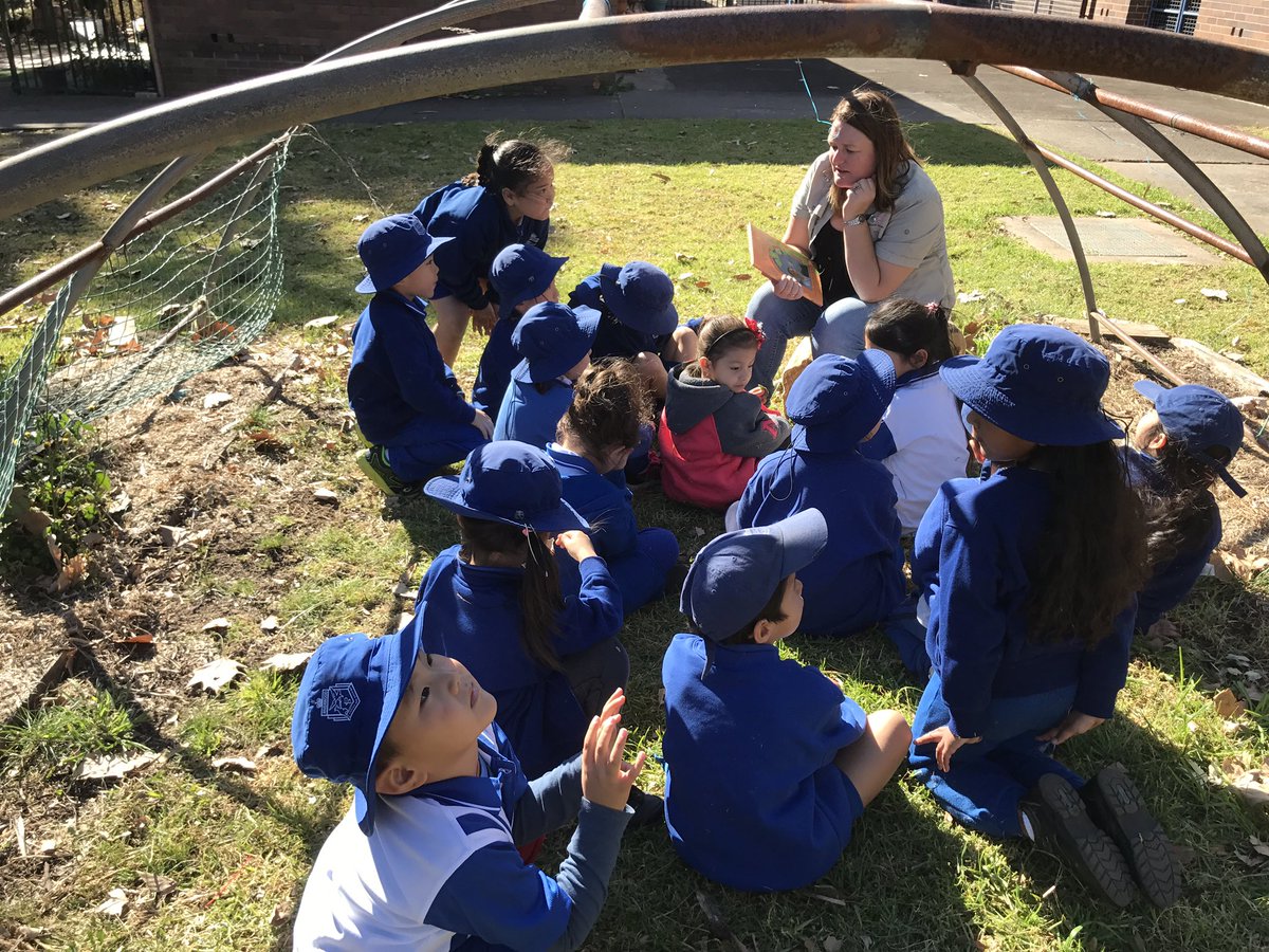 KM enjoying using their senses to explore the garden!