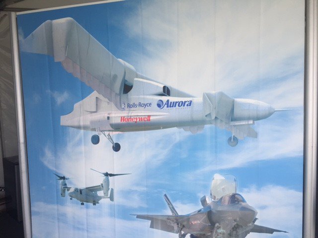 AuroraFlightSci's tweet photo. We're at @EAA AirVenture #Oshkosh17! Aurora's D8 Xplane at @NASA booth and LightningStrike XV-24A at @RR booth! #changingaviation https://t.co/88eUJR9trt