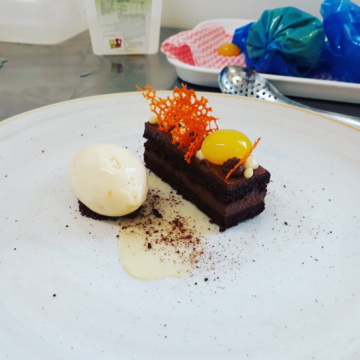GenoiseJoe's tweet photo. Chocolate orange slice with orange coral, orange reverse specification, white chocolate cremeux and tonka bean icecream! https://t.co/GUsUx3wsmf