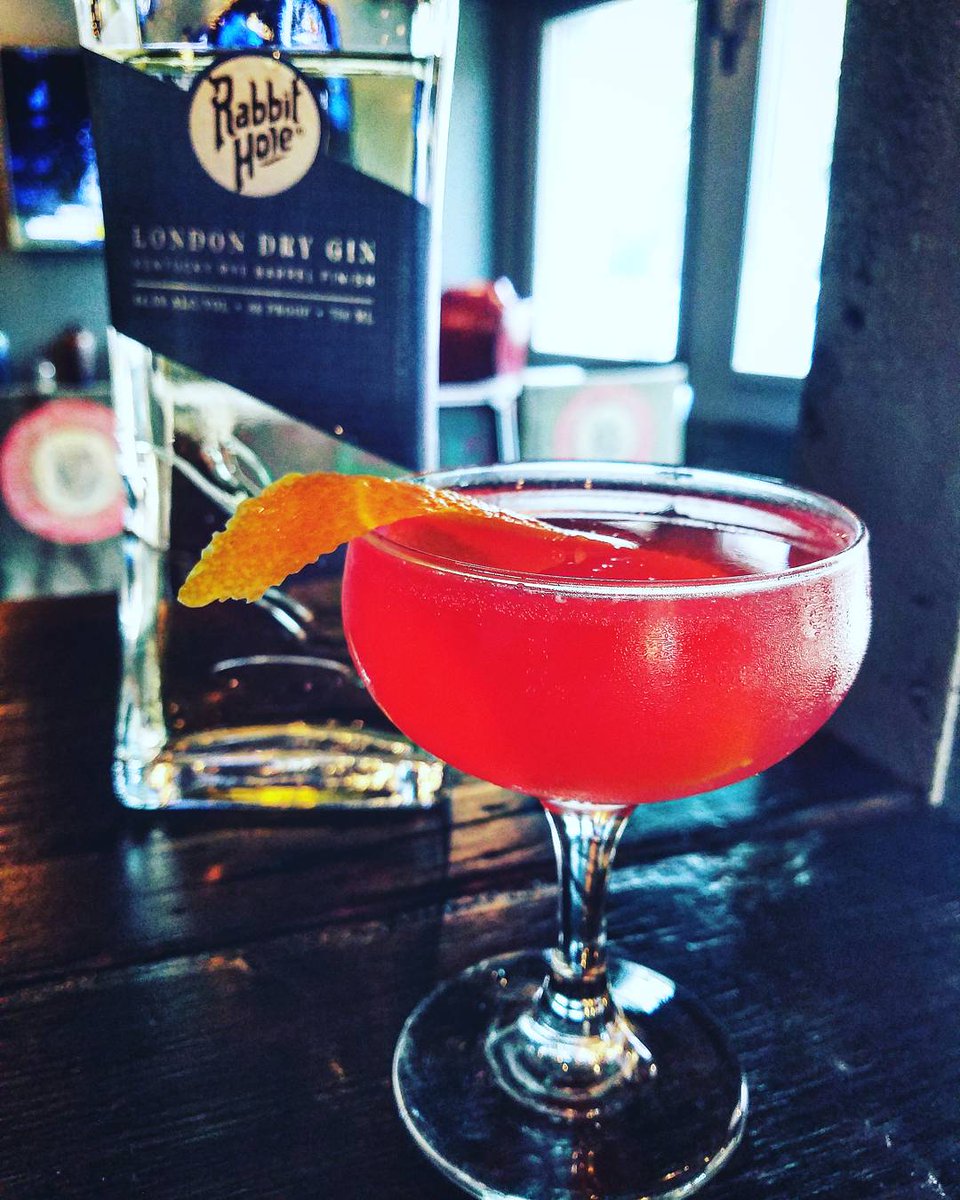 This is a sneak peek of a cocktail called the Ruby Rose. Made with Rabbit Hole London Dry Gin, Campari, Lemon, Simple Syrup, and Champagne!