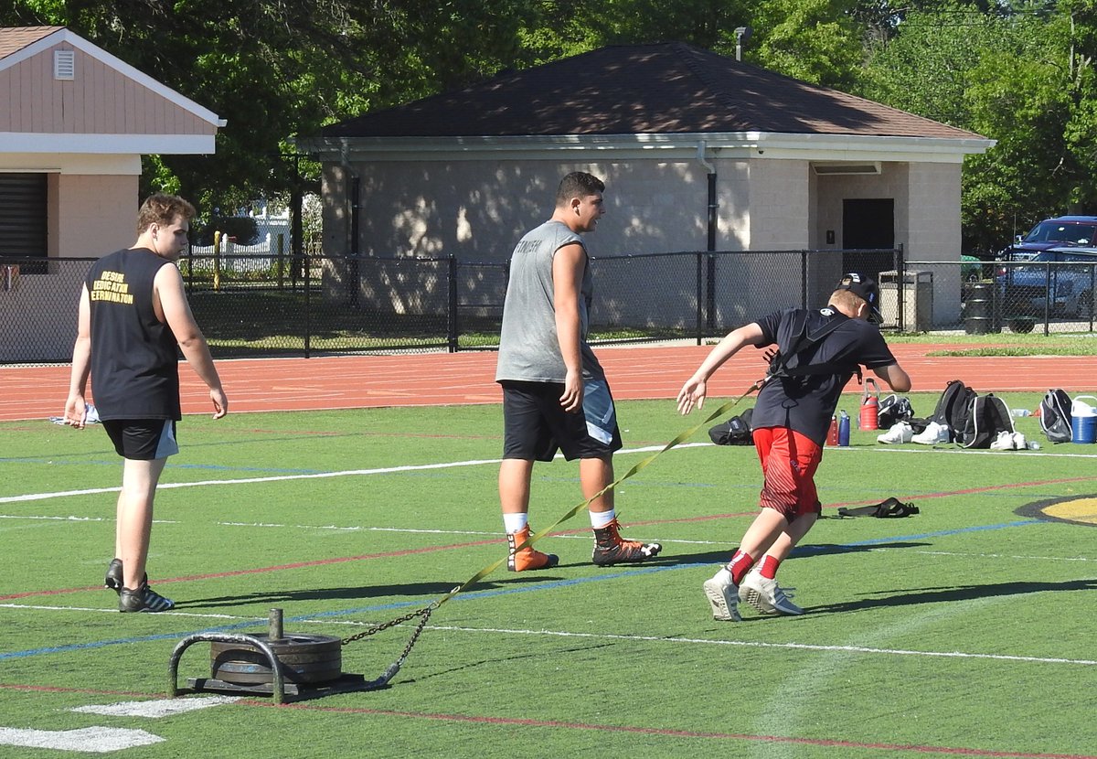 CommackSchools's tweet photo. Football season is almost here! #oneadays These guys are working hard - that weight he's dragging is over 200lbs. #macksummer #cougarpower https://t.co/wbdXBxkSFW