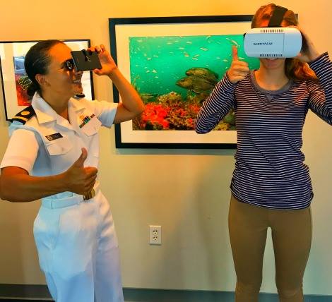 GraysReefNMS's tweet photo. Ensign Marybeth Head &amp; intern Sarah Glover taking a virtual dive in the office today! You can too at @liveoakplga Aug. 12 #ILoveMySanctuary https://t.co/Q4UhZKKbXU