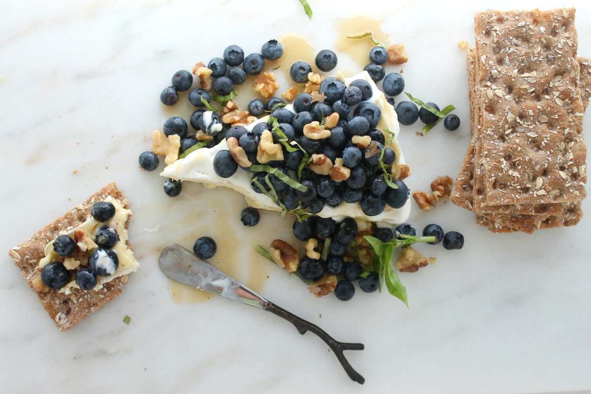 Honey Drizzled Brie with Blueberries, Walnuts &amp; Basil. A gorgeous no-cook summer dessert that’s ready in 5 minutes: jennyshearawn.com/honey-drizzled…