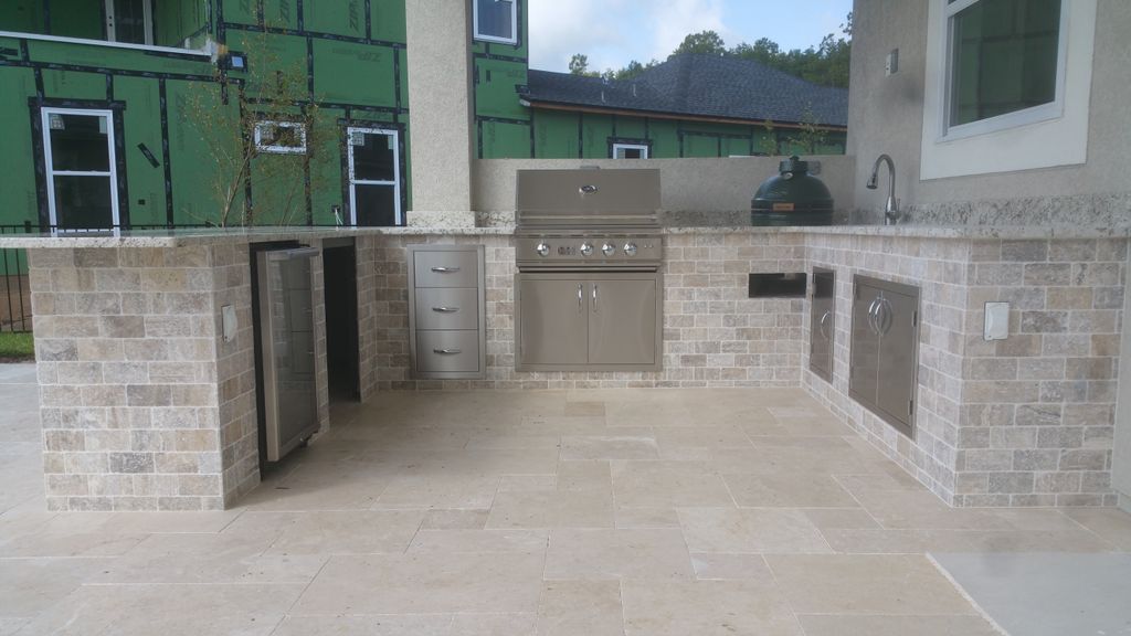 Look at this amazing project we just finished! This fantastic pool includes a stunning outdoor kitchen with a built-in Green Egg.