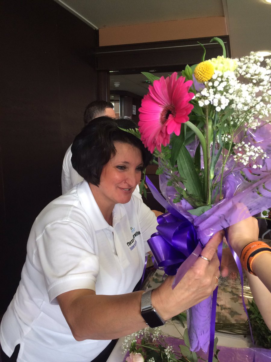 Maria from our Heanor funeral home helping the children from Belarus make some floral gifts for their host families