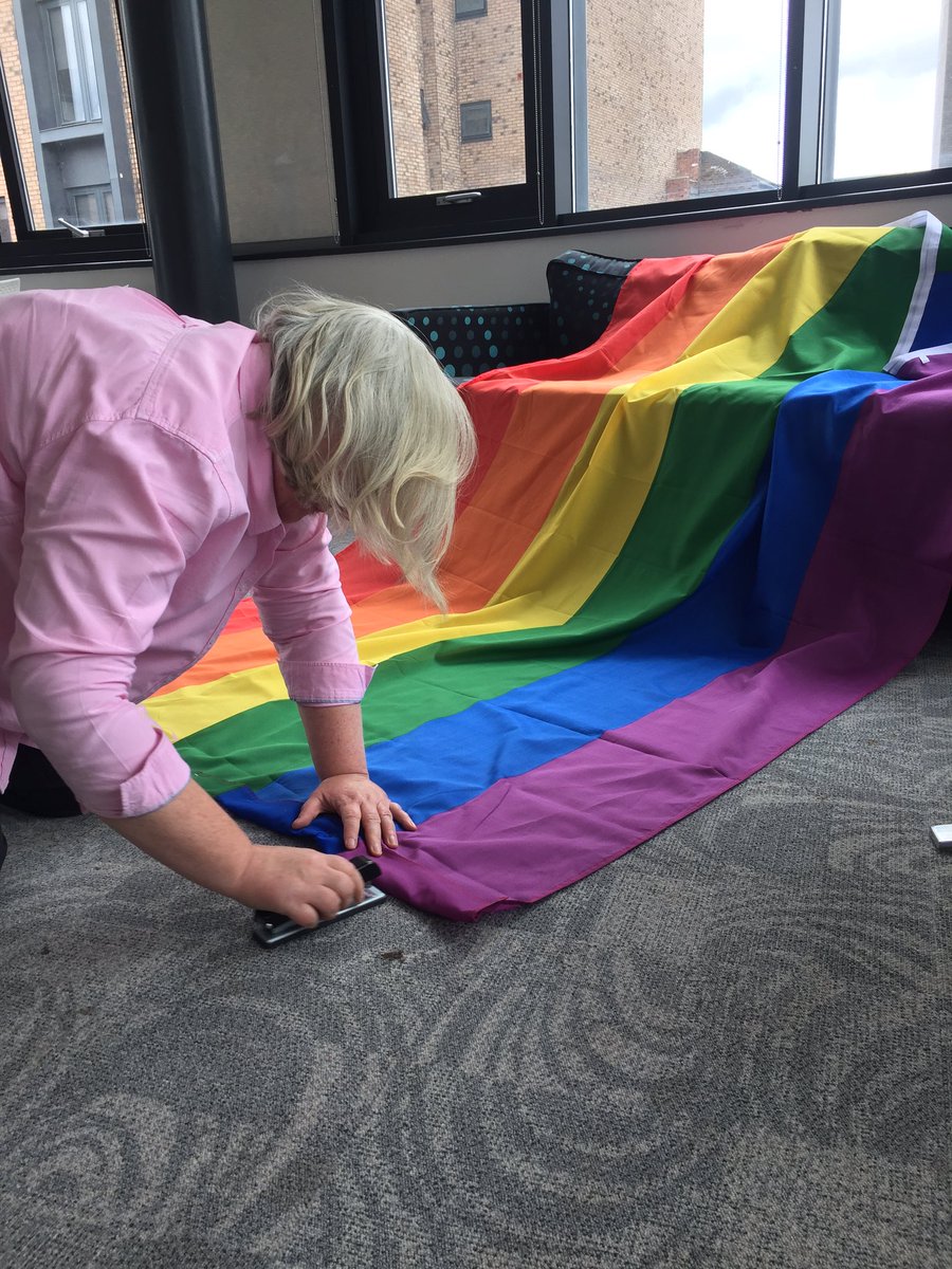 TheWomensOrg's tweet photo. Just your normal Thursday...CEO Maggie getting our Pride flags ready 😂🌈💕 https://t.co/PyPX3S9gch
