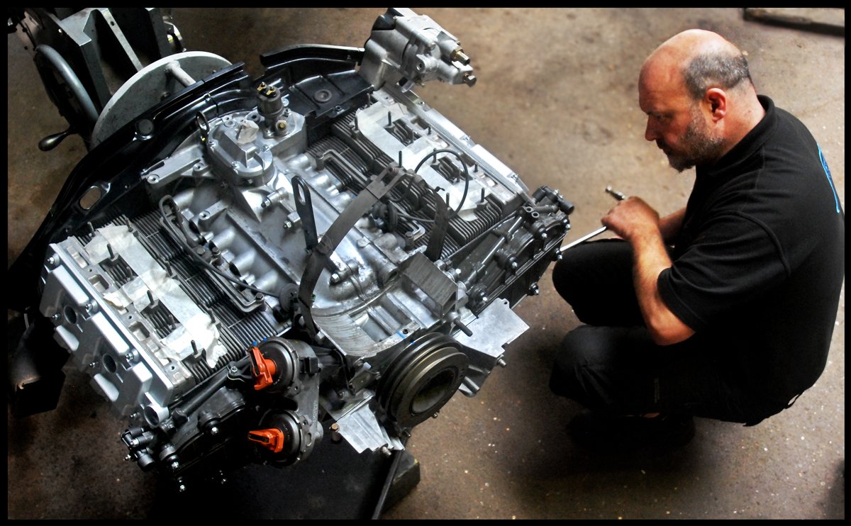 Air-cooled excellence - #Porsche 911 3.6 #engine #rebuild near completion - Ashley fits spark plugs prior to engine refit to 964 Cabriolet