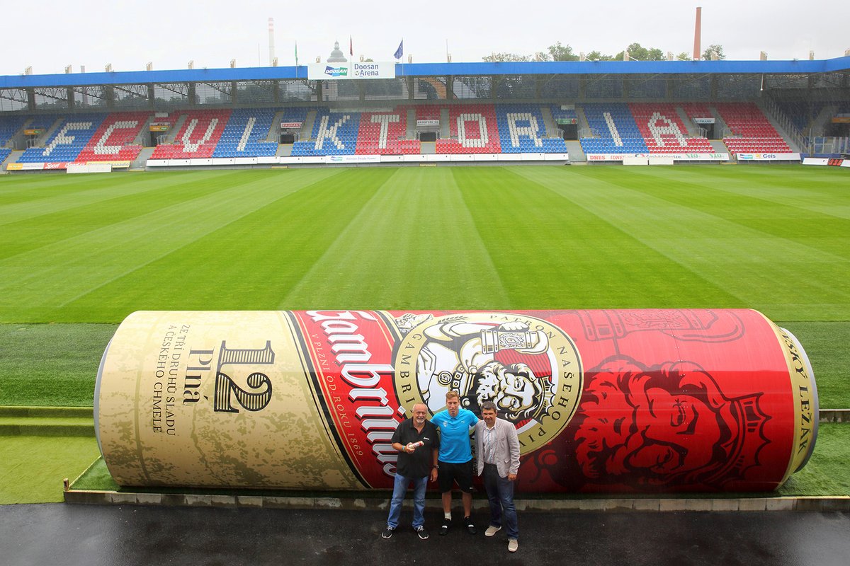 FOS's tweet photo. FC Viktoria Plzeň (@fcviktorkaplzen) now has dugouts that look like beer cans! Great use of a space for a unique sponsor activation! https://t.co/E8dFUA8uxZ