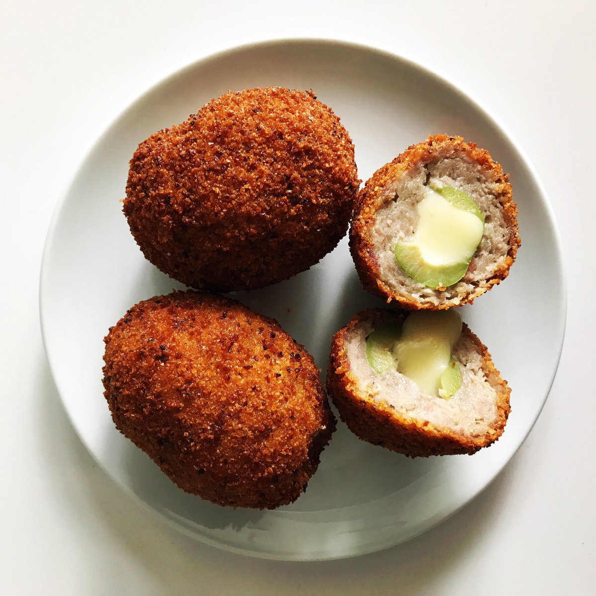 Yes this is a Olive Stuffed with Fontina Cheese, wrapped in house-made Norcia Sausage, breaded and fried to perfection just for 👉you.