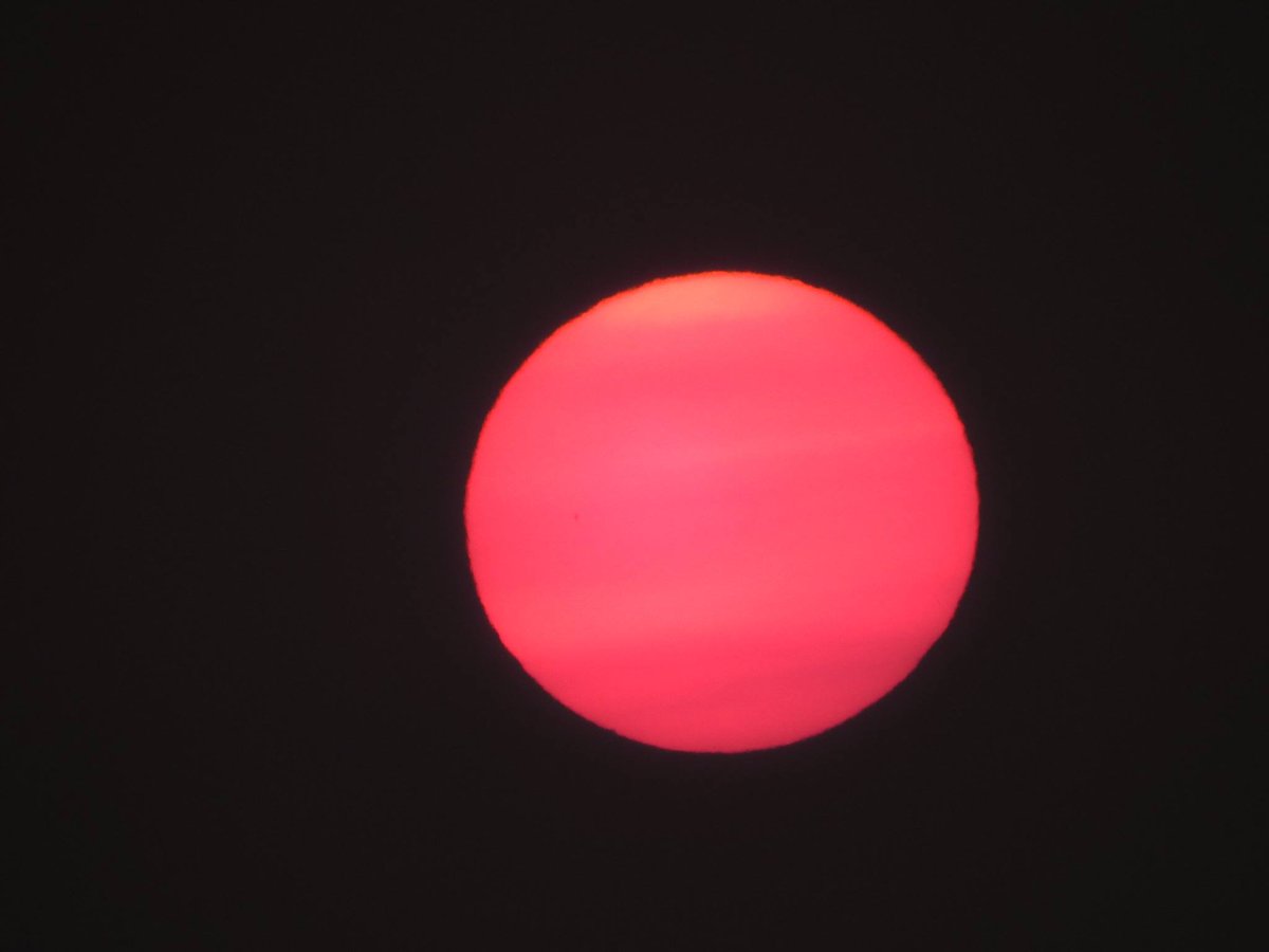 Robert Alberg Hi I Photographed A Pink Red Sun In The Sky Over Puget Sound Washington Using Nikon Coolpix P900 Camera