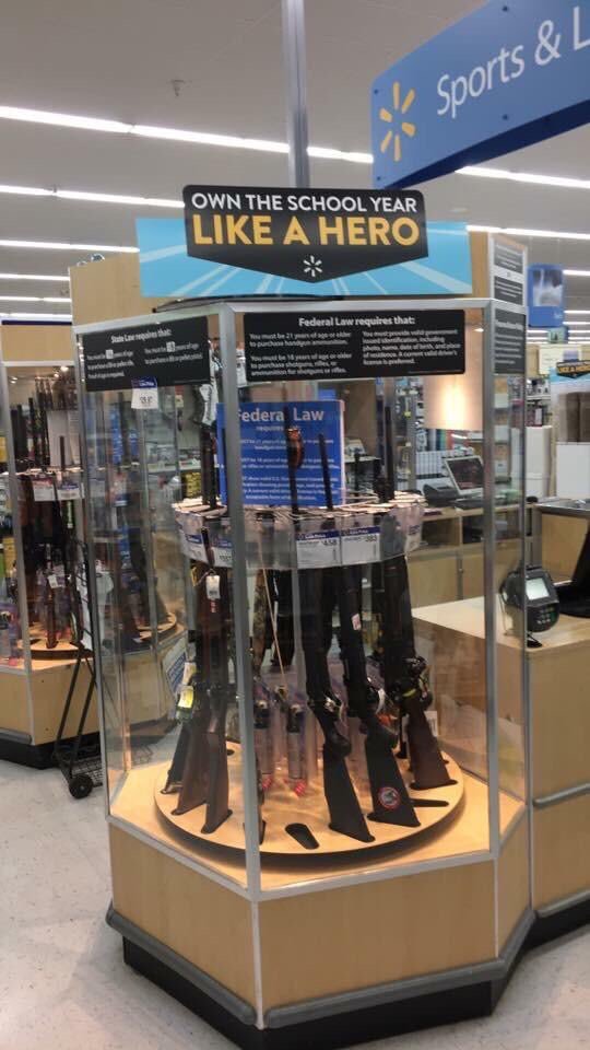 In the US, a network of Walmart stores apologized for a stand of weapons under the ad "Own the school year like a hero" DG0YE49UIAABr9m