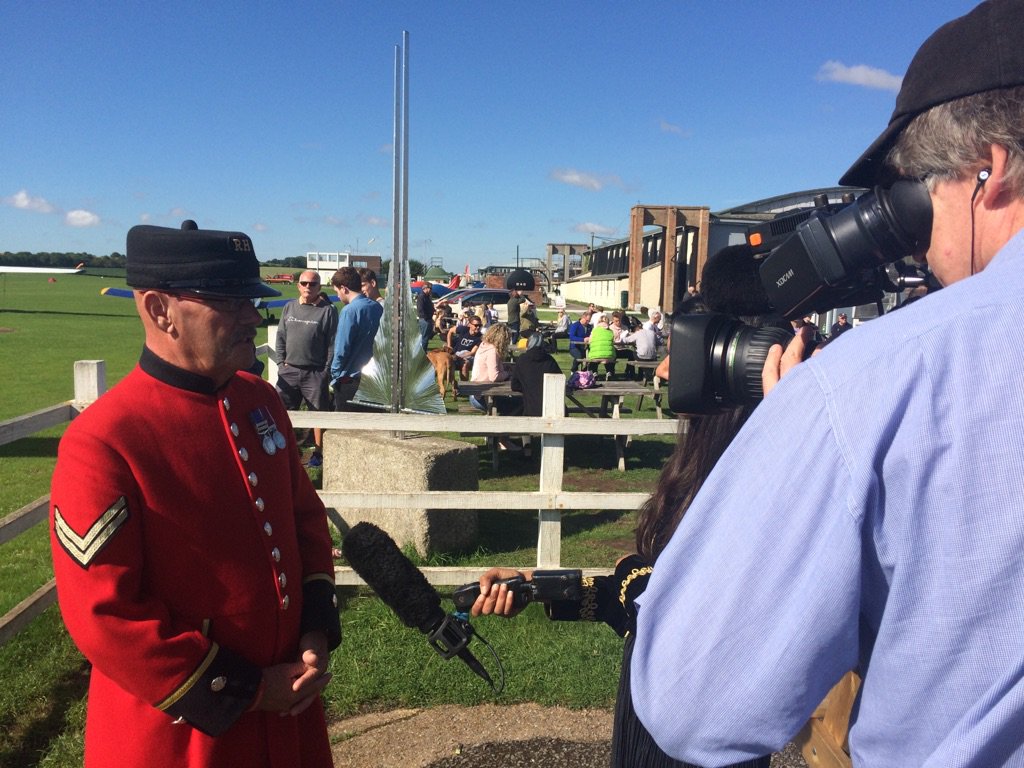 Mike Smith (68) being interviewed by <a href="/ITV/">ITV</a> at <a href="/OldSarumEGLS/">Old Sarum Airfield</a> before he makes his 100th jump. He'll be with 3 WWII vets (all 91) &amp; @reddevils.