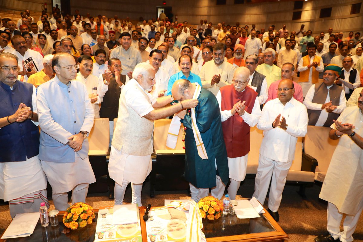 BJP4India's tweet photo. PM @narendramodi felicitates Shri @AmitShah on completing 3 years as @BJP4India President and being elected to Rajya Sabha from Gujarat. https://t.co/gmcIaBBBNk