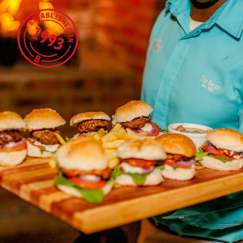 Can we suggest you try our--> Slider Platter
Mini Baron beef and chicken burgers, served with a choice of three sauces and chips.