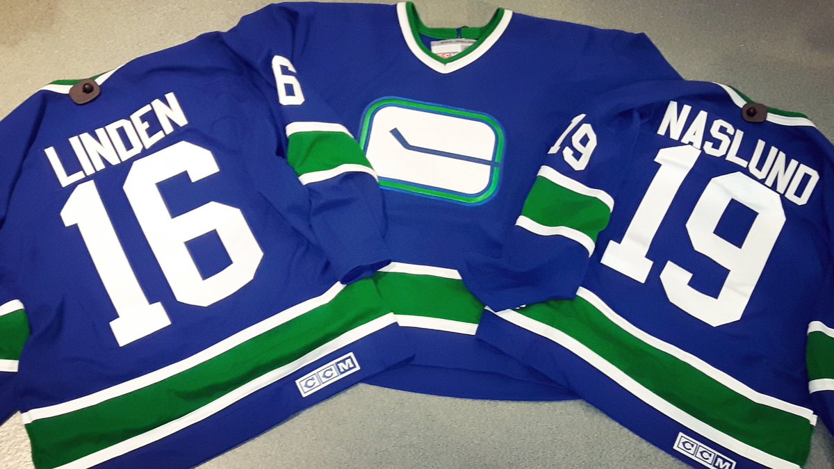 canucks stick in rink jersey