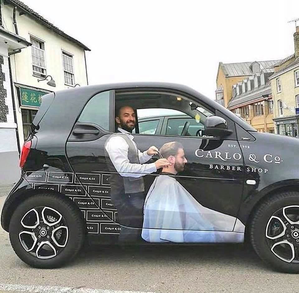 simonsugar's tweet photo. Clever car wrap from a barber shop https://t.co/CwhTY0Pgrb